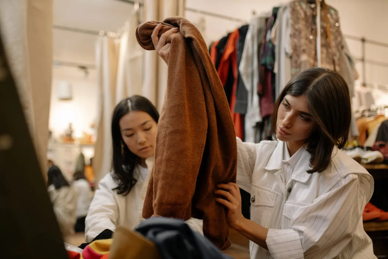 Two founders reviewing a garment together