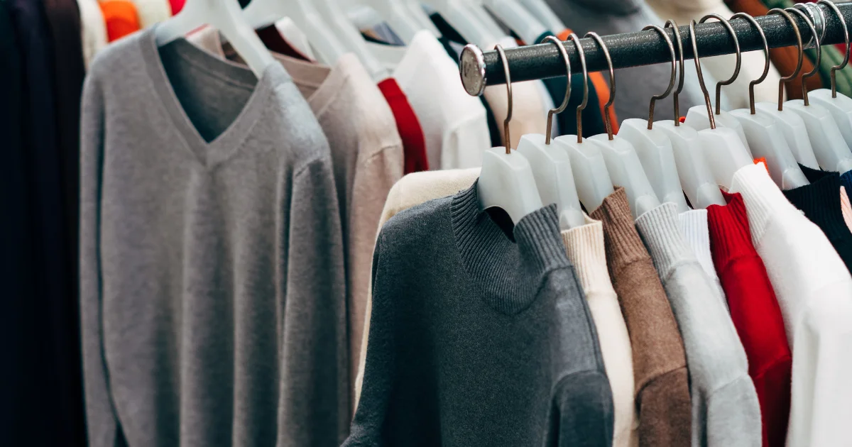 Rail of knitwear in a clothing studio