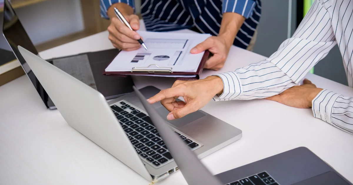 Planning a brand launch over a laptop and checklist